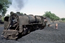 Train to Patalpani 020 - YP 2178 get its load of coal by local Indian woman outside the Mhow shed 1997