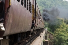 Train to Patalpani 091 - Passengers sit on the doorplate to enjoy the view